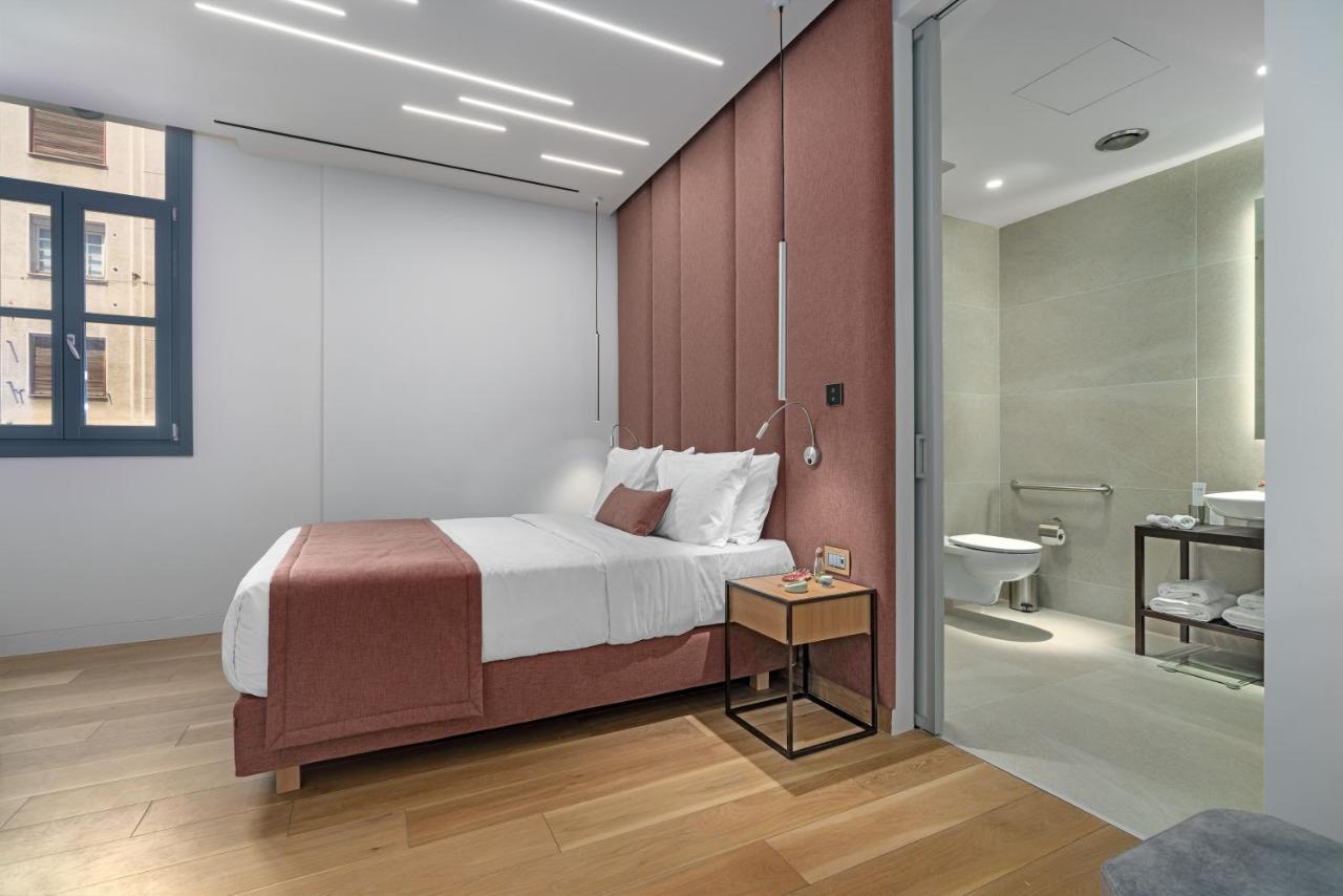 Hellenic Vibes Smart Hotel Atene Esterno foto A bedroom at the hotel