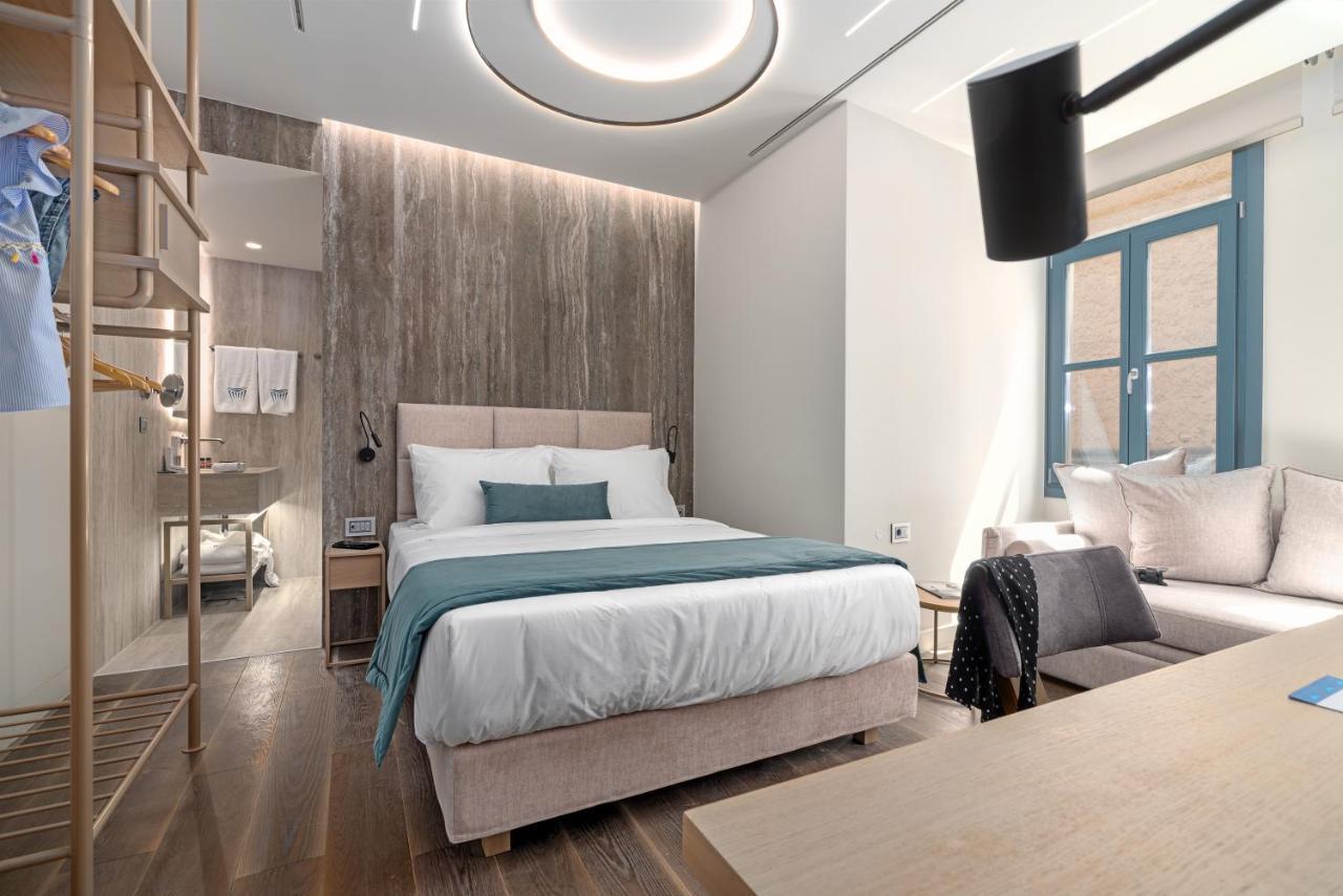 Hellenic Vibes Smart Hotel Atene Esterno foto A room at the hotel