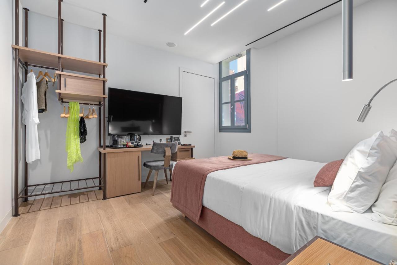 Hellenic Vibes Smart Hotel Atene Esterno foto A room at the hotel