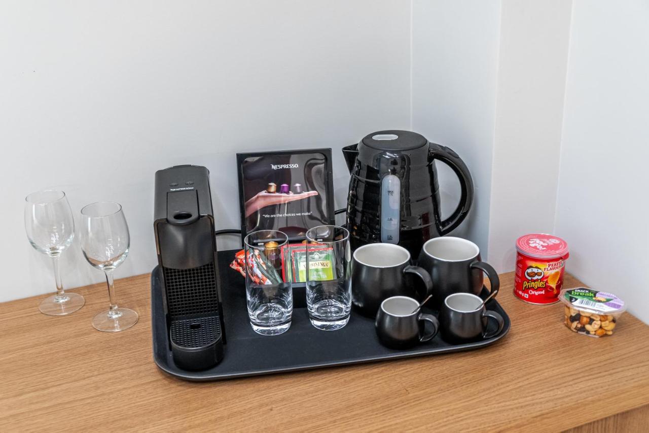 Hellenic Vibes Smart Hotel Atene Esterno foto A Nespresso coffee machine in a hotel room